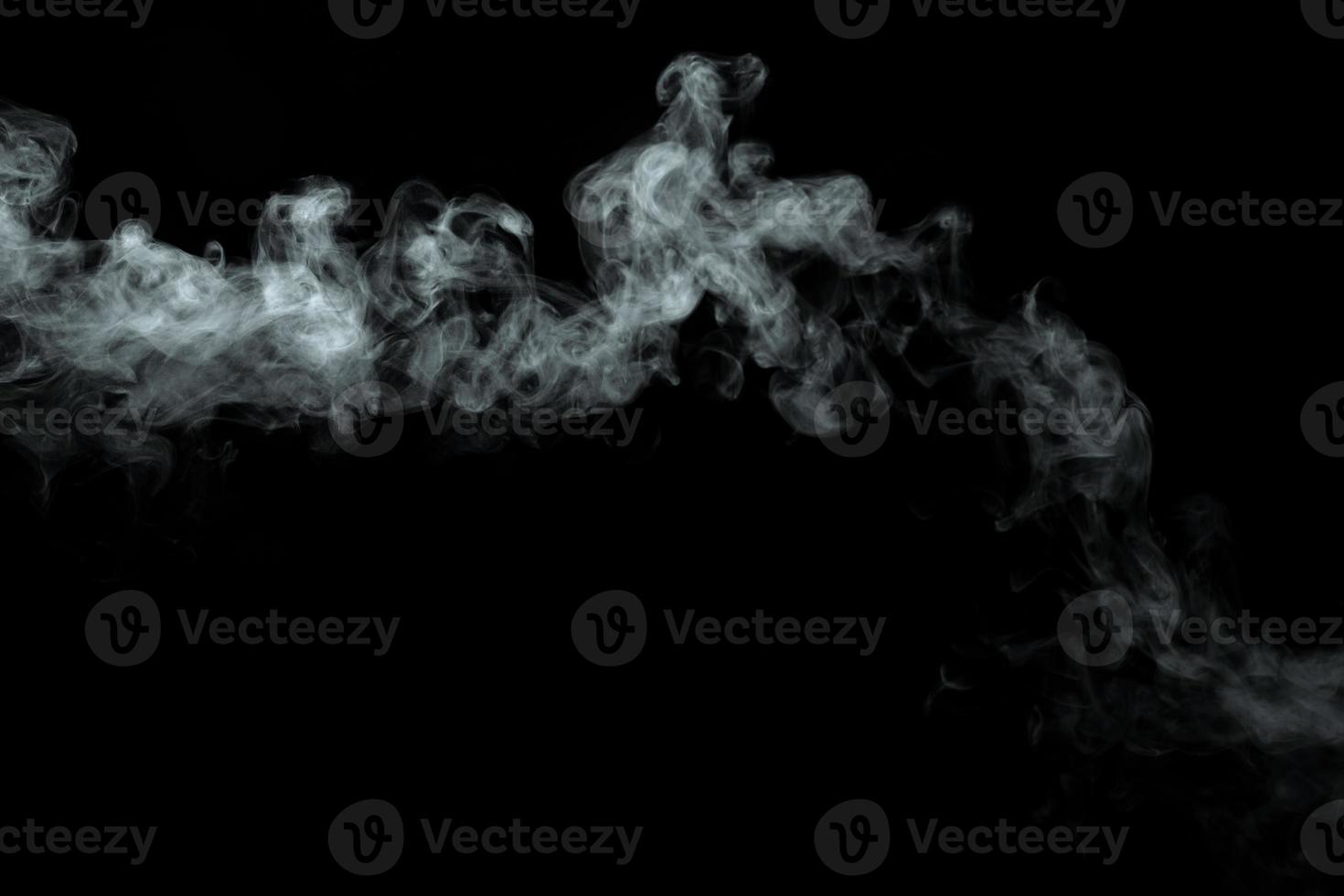 Abstract powder or smoke isolated on black background photo