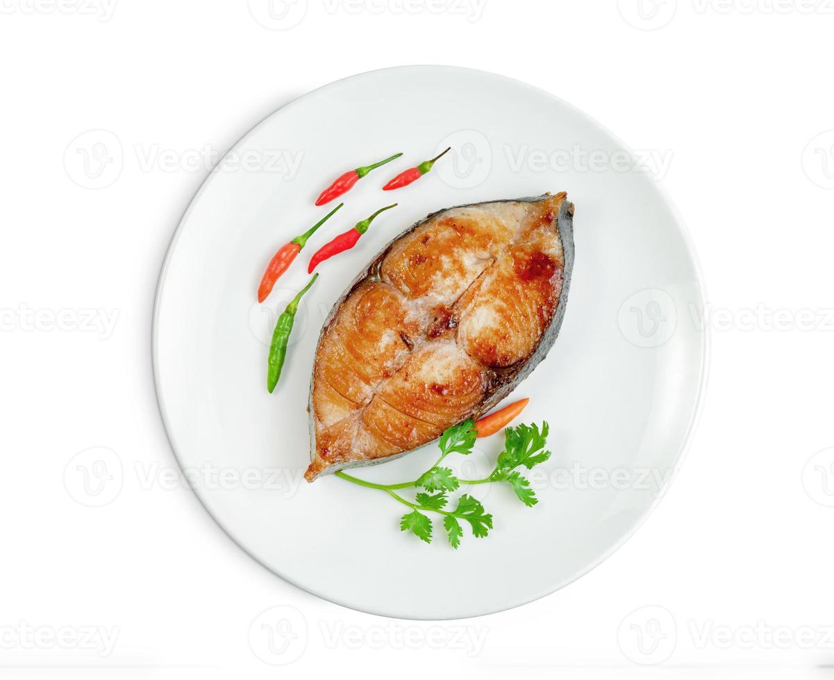 King mackerel or spotted mackerels steak with dish isolated on white background ,fried Scomberomorus fish ,include clipping path photo