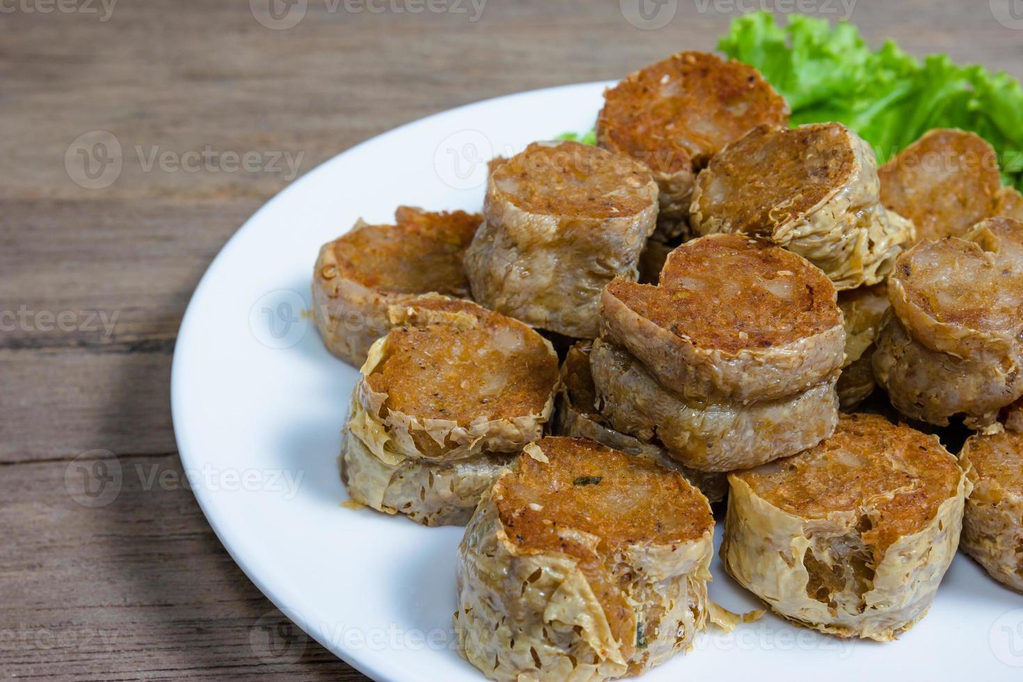 Deep Fried Crab meat roll or Hoi jo on wood  background photo