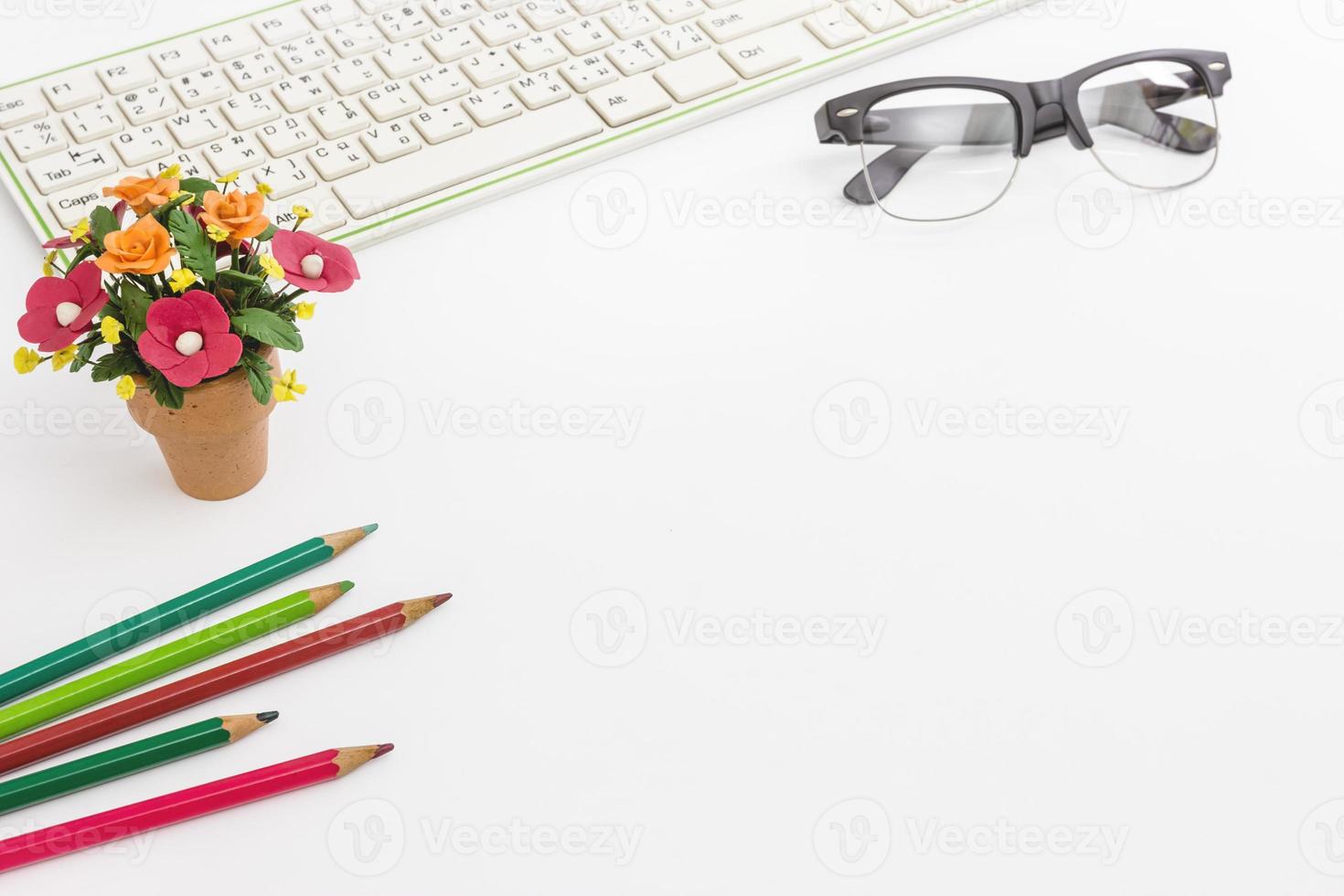 Color pencil and keyboard and flower pot,business concept photo