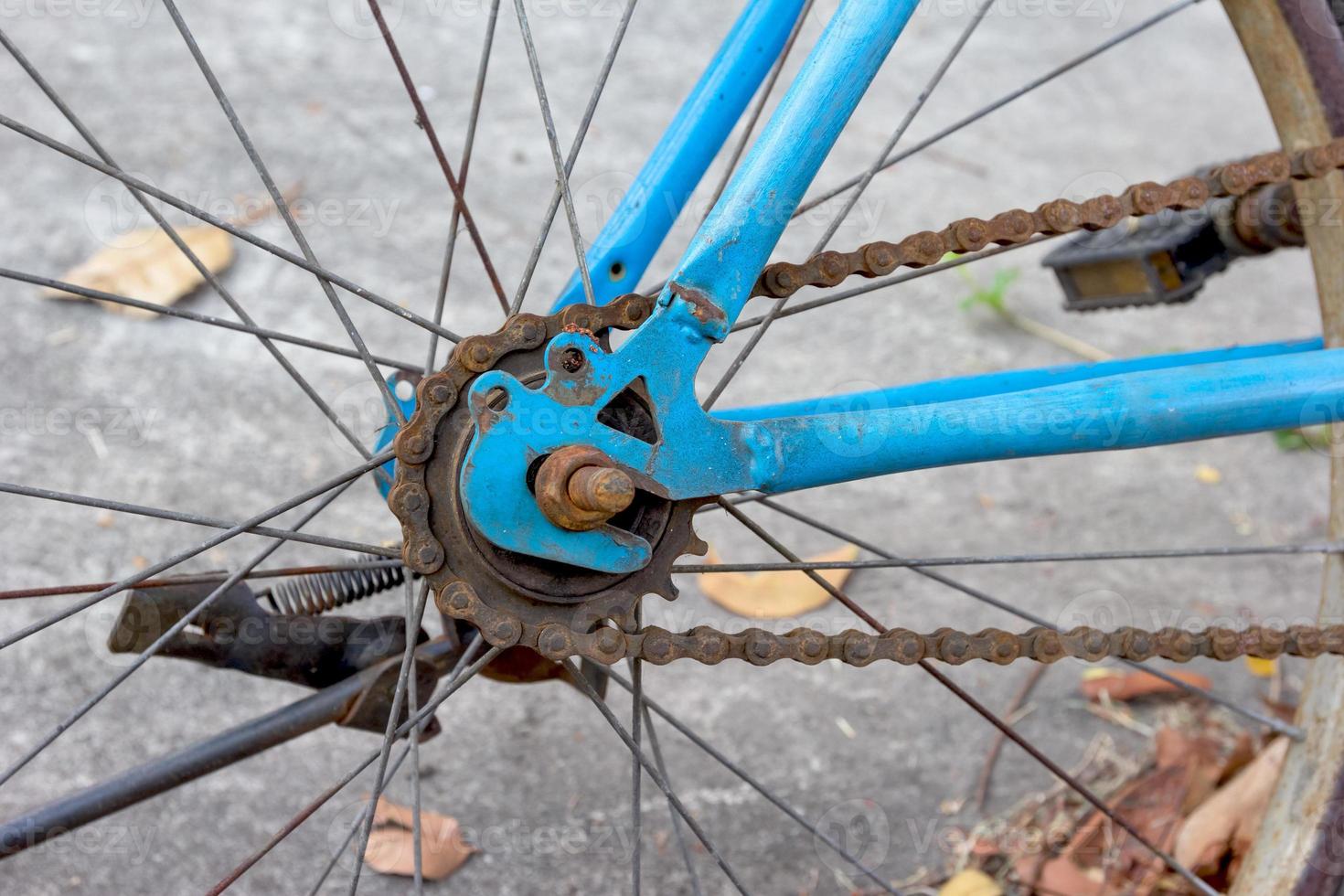 closeup rear wheel with chain and sprocket photo