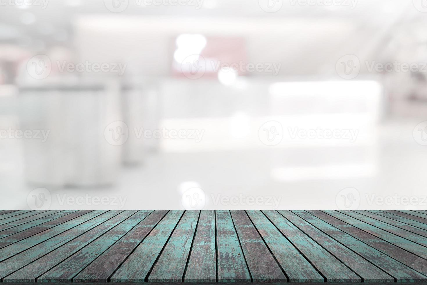 Empty wooden board space platform with register counter blurry background photo