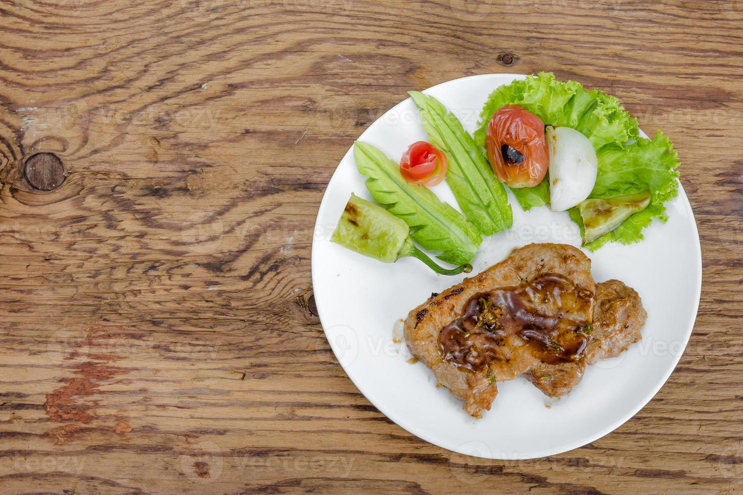 Grilled steak meat with vegetable salad photo