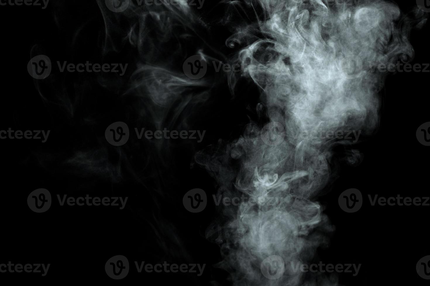 Abstract powder or smoke isolated on black background photo