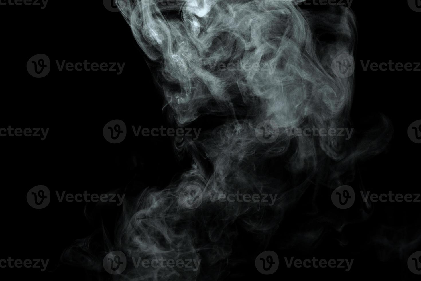 Abstract powder or smoke isolated on black background photo