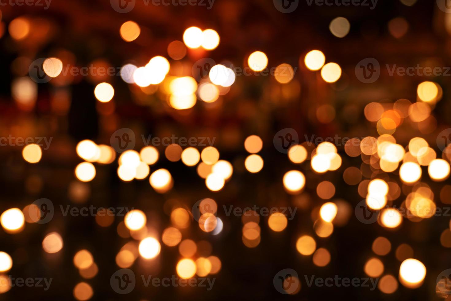 Colorful orange bokeh background of Christmas lights and New year photo