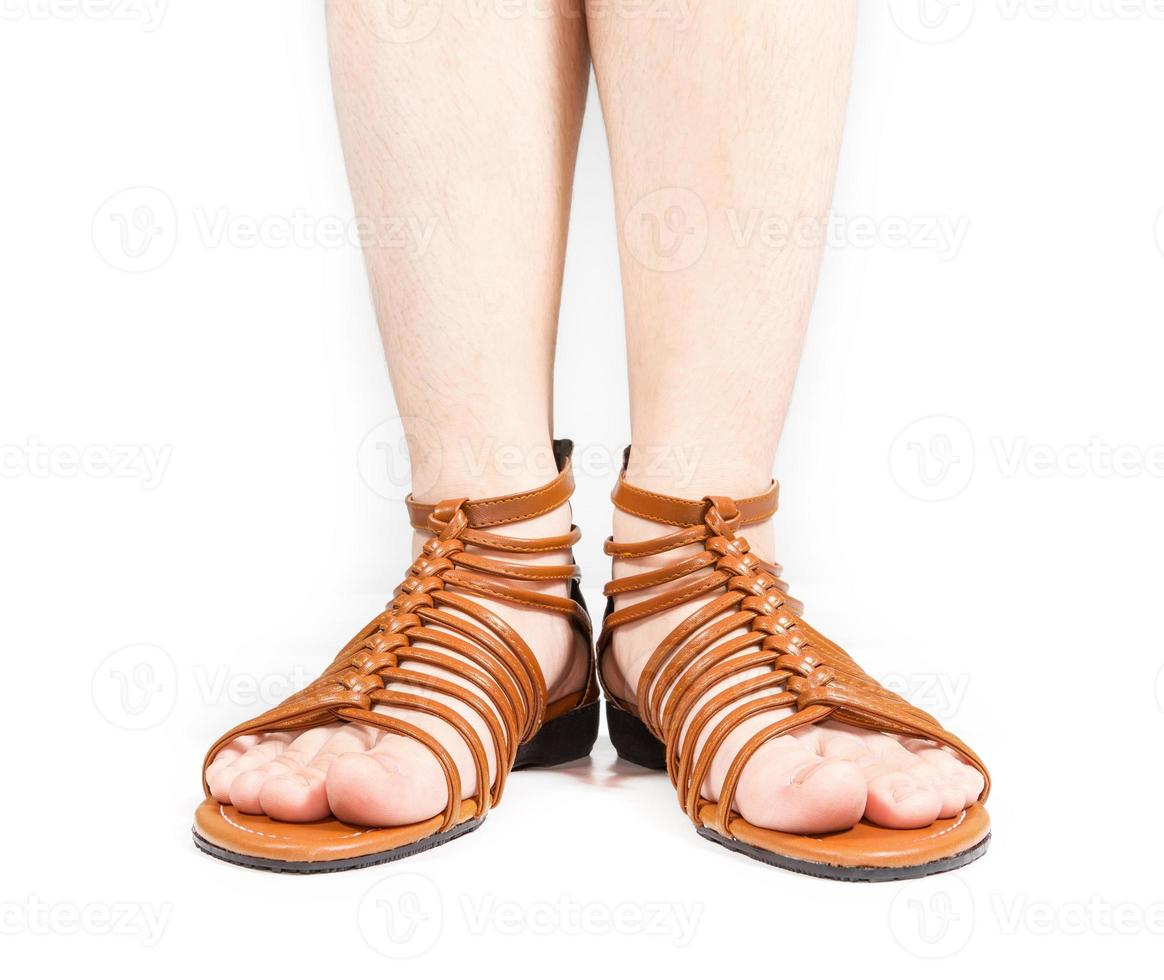 Female leg in brown shoes on white background photo