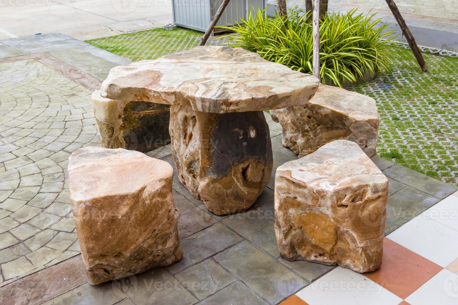 stone table set in garden photo