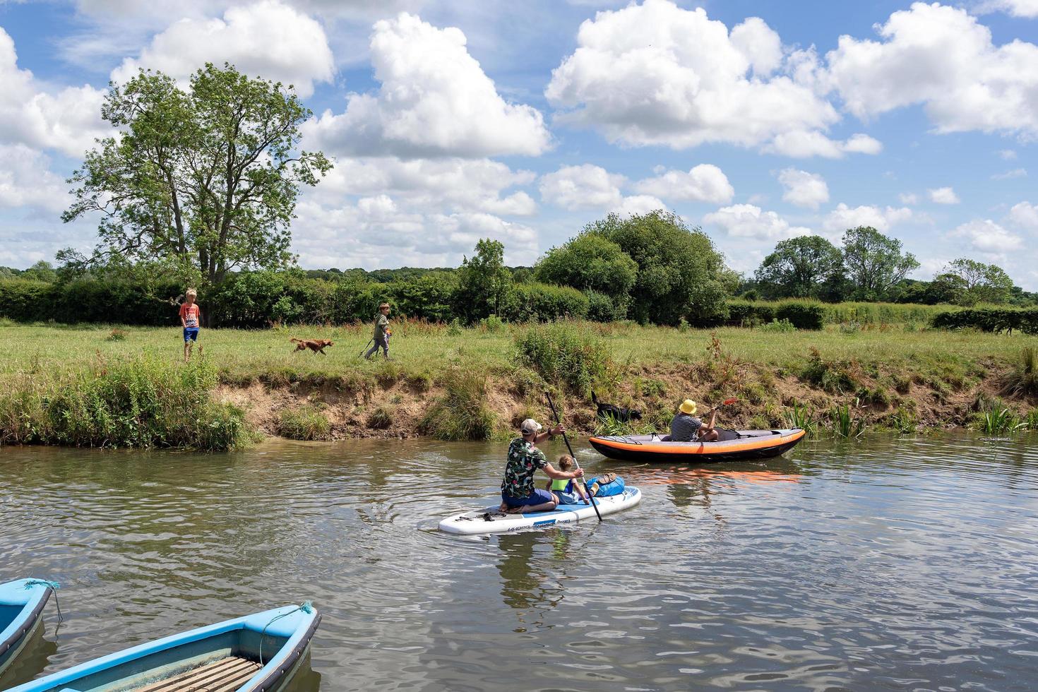 BARCOMBE, EAST SUSSEX, UK - JUNE 26, 2022. Boating by the Anchor pub in Barcombe on a summers day. Unidentified people photo