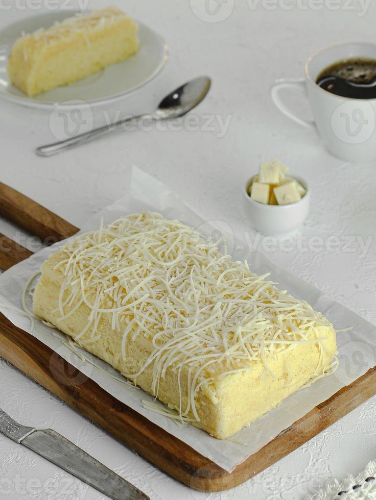 Sponge cheese cake served with hot tea photo