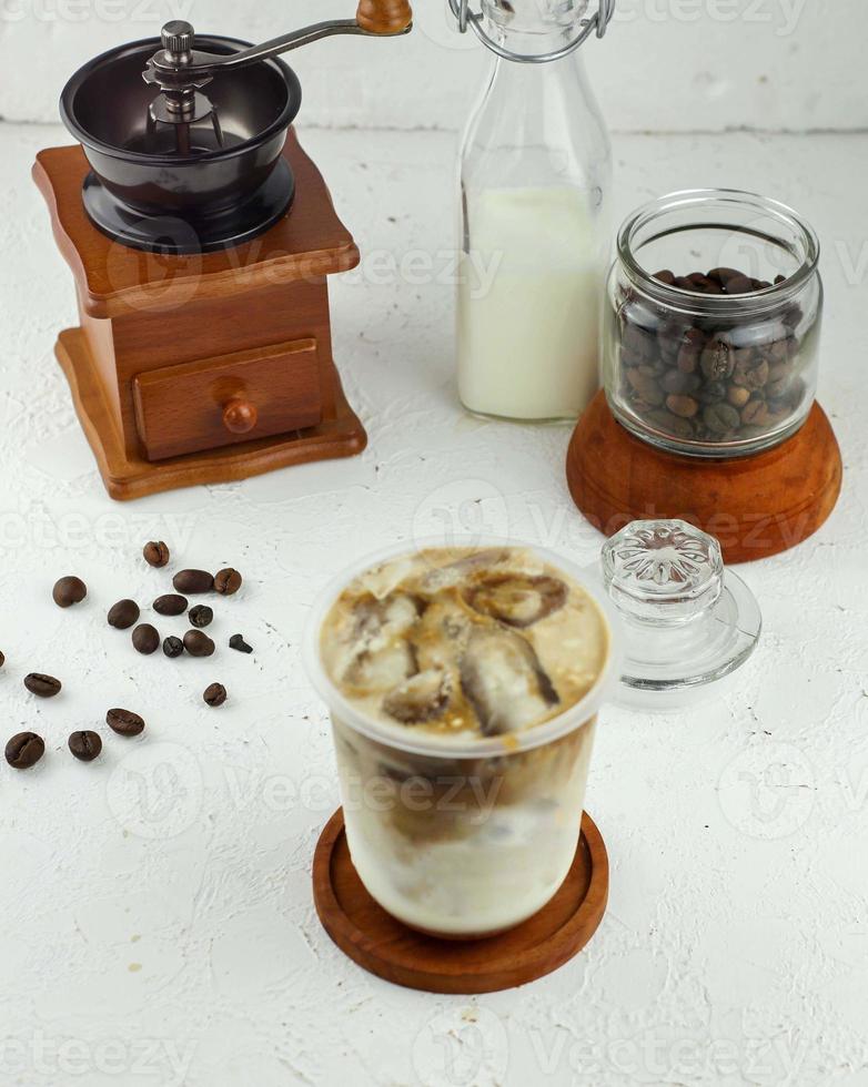 Iced coffee with milk, chocolate syrup and ice photo