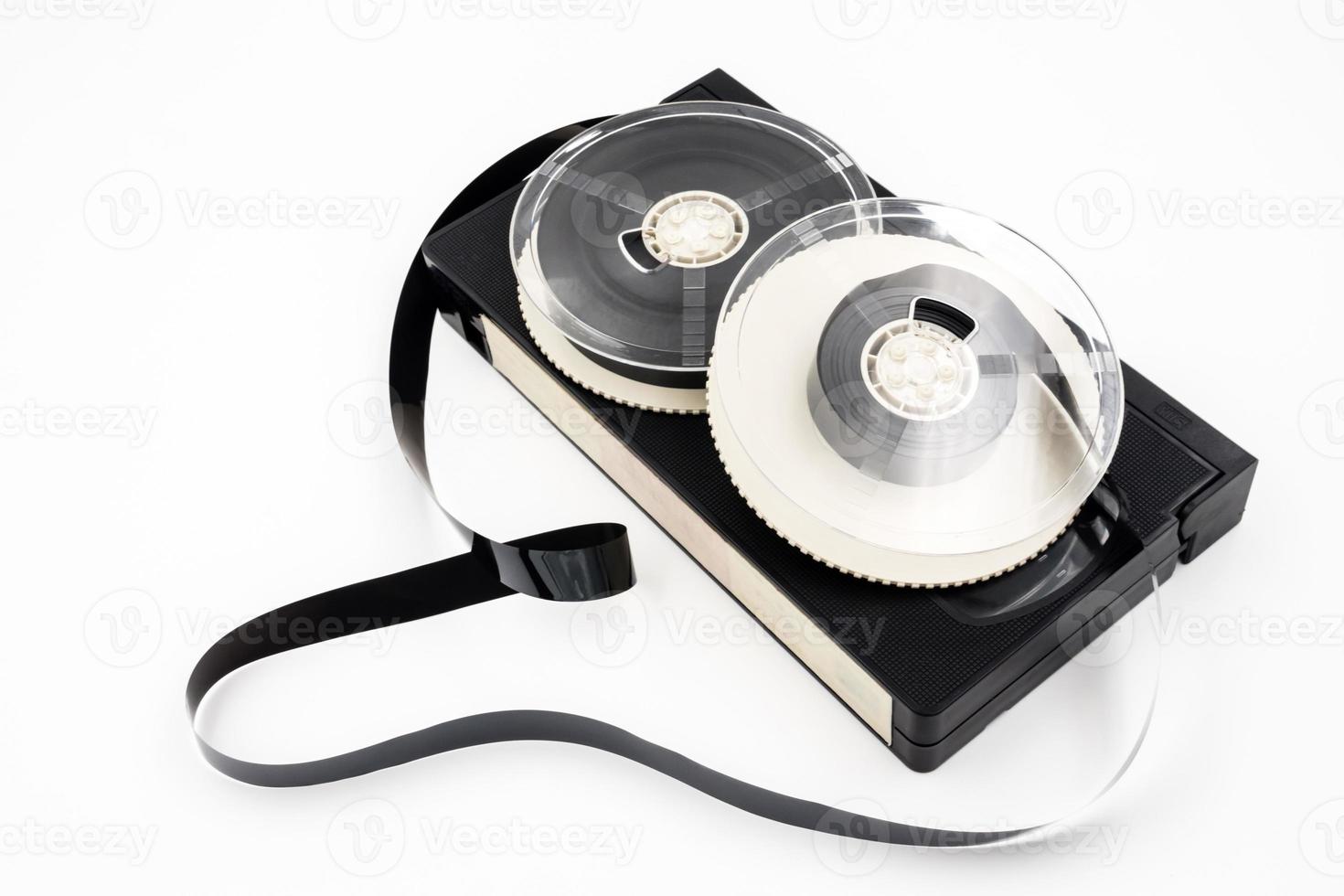 Video cassette tape and reel on white background. photo