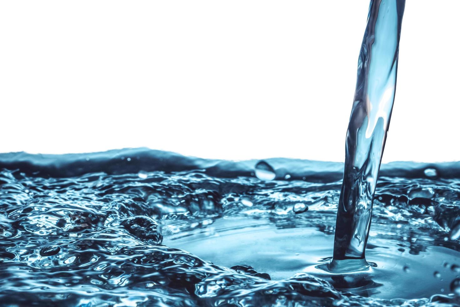 Close up of Pouring water on water surface background. photo