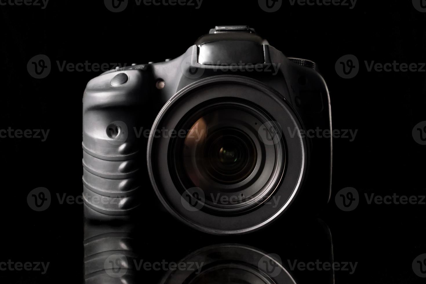 Digital camera on black background. photo