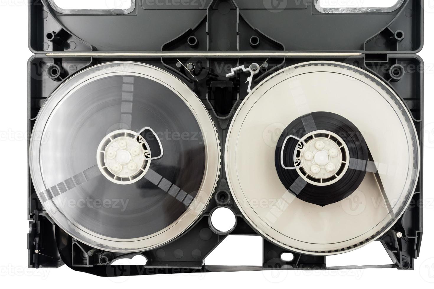 Open video cassette tape on white background. photo