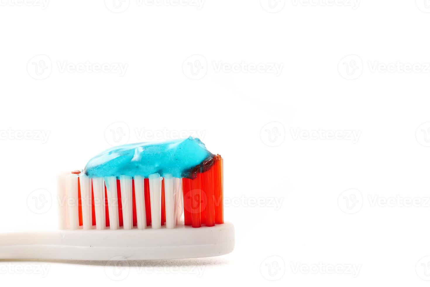 Close up of Toothbrush with toothpaste on a white background. photo