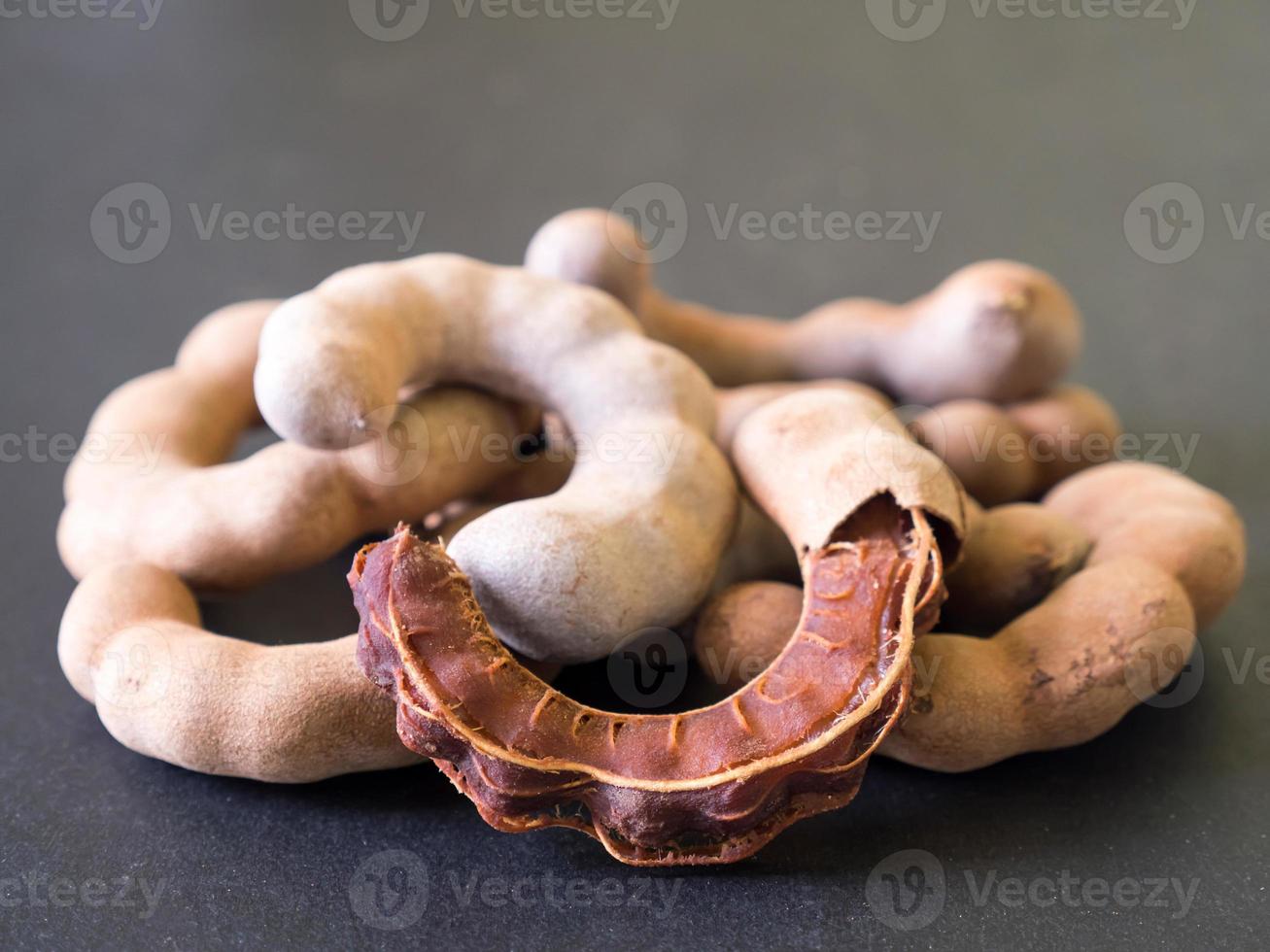 Sweet tamarind on black background. Soft focus photo