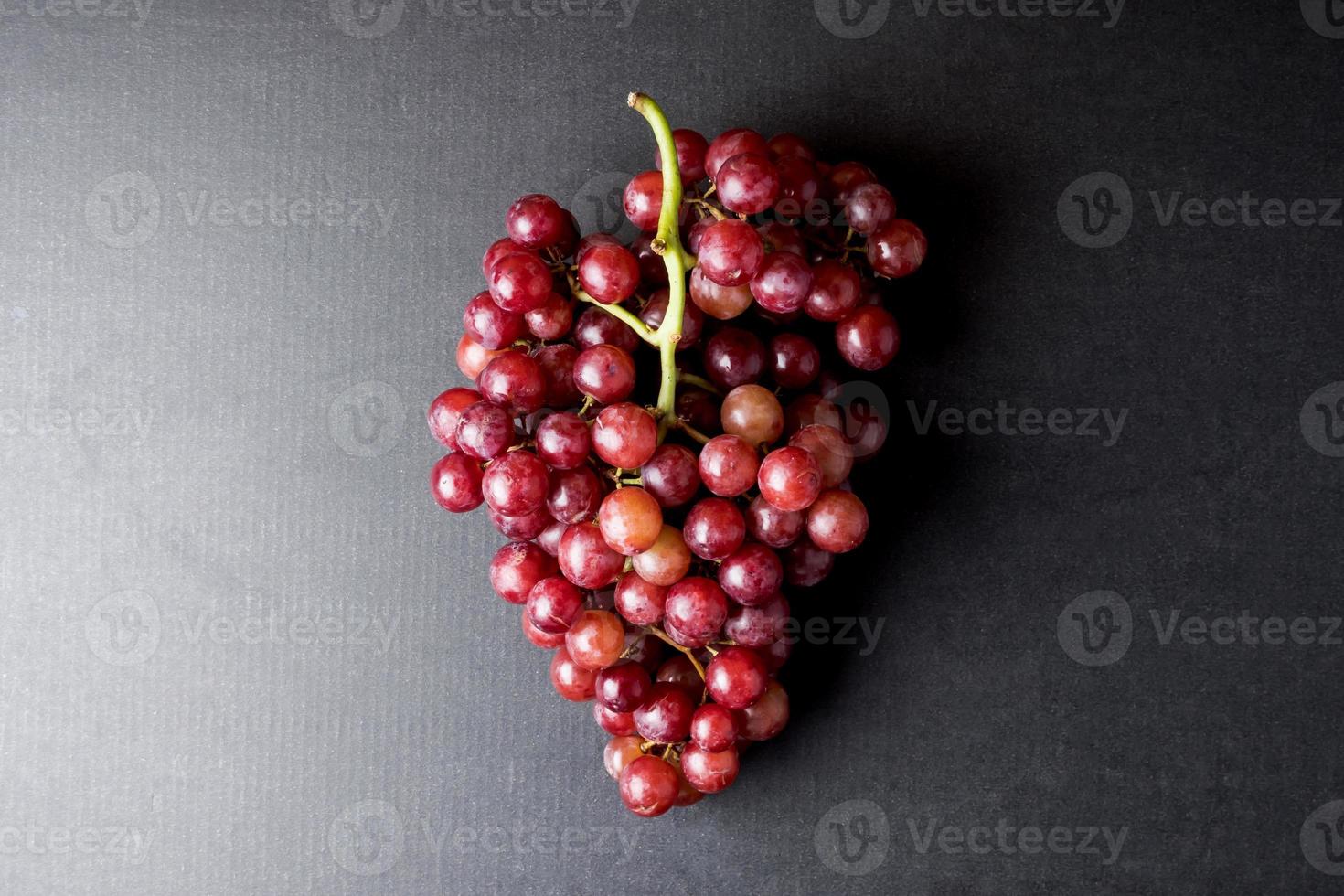 Top view of Red grapes on a black background. photo