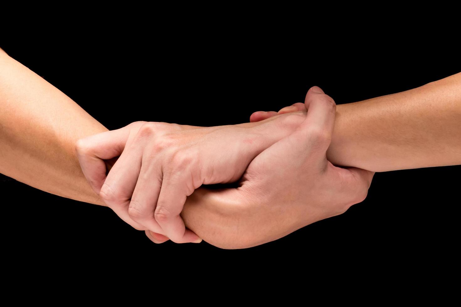 Male hands on a black background. photo