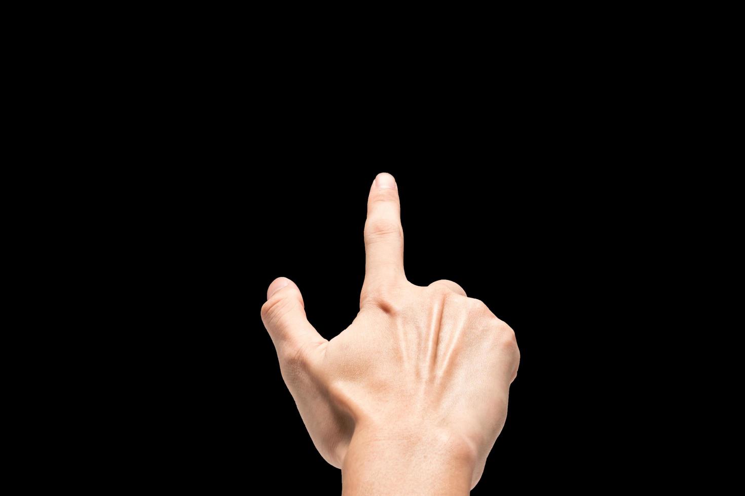 Male hand on a black background. photo