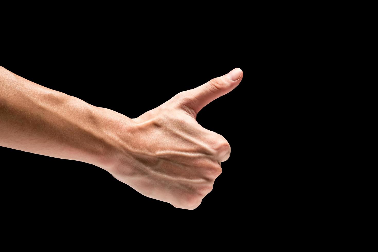 Male hand on a black background. photo