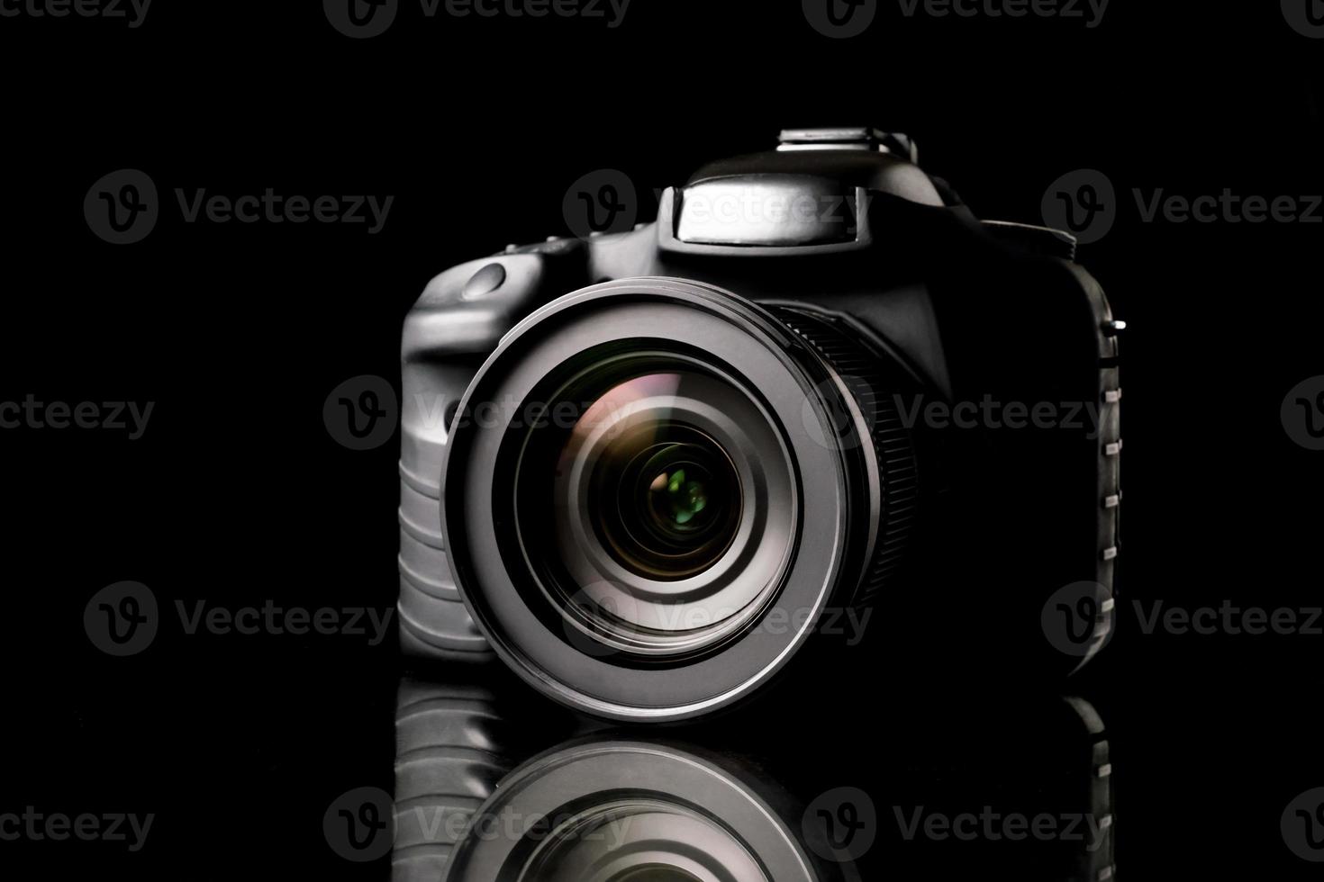 Digital camera on black background. photo