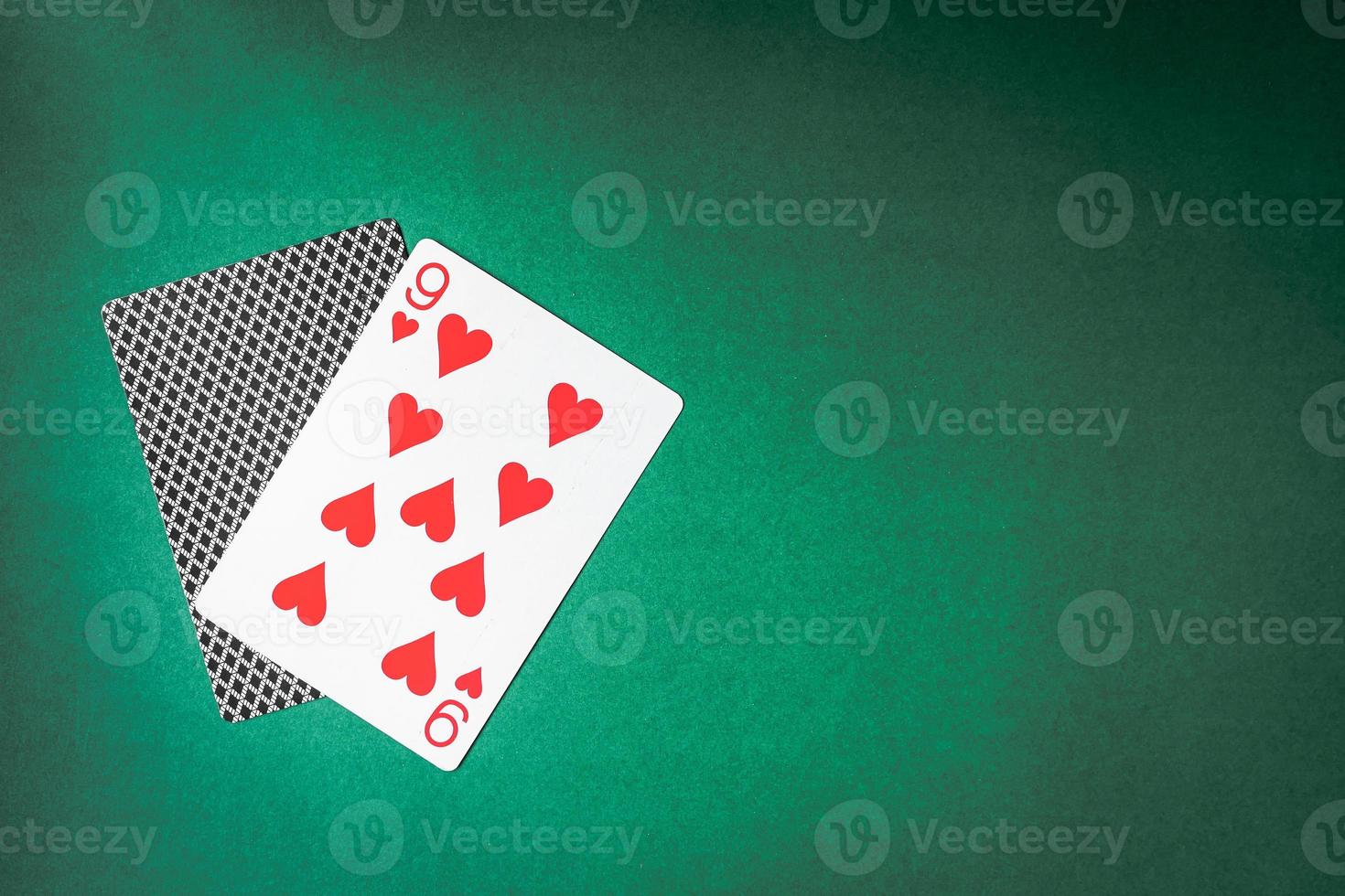 Playing card and back designs on green background. Free space for text photo