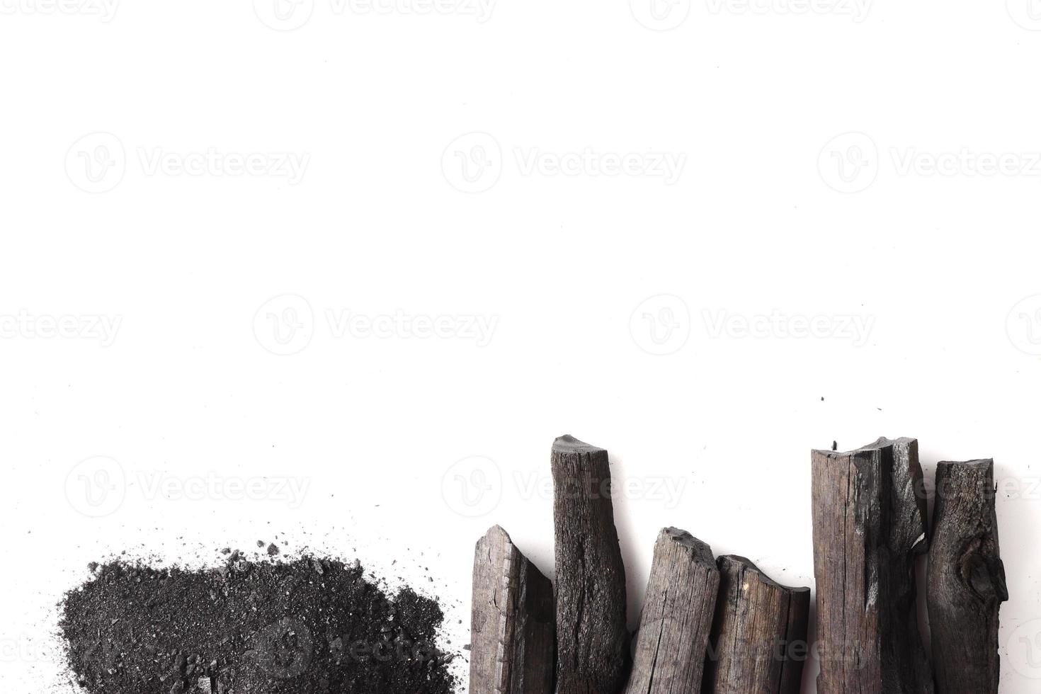 Charcoal and powder on white background. Free space for text photo