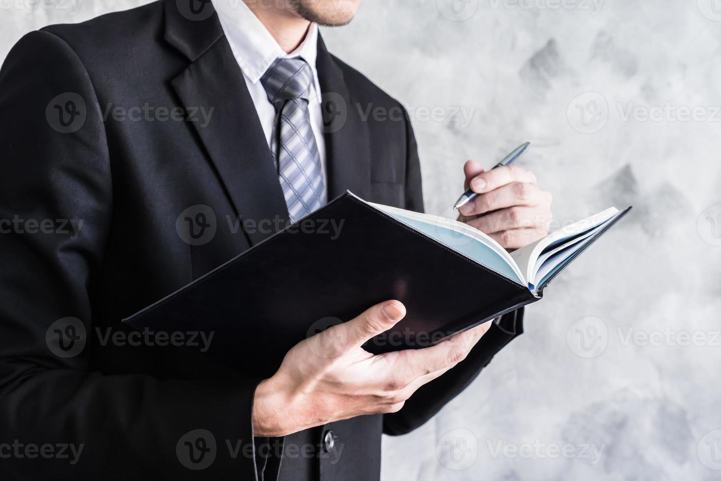 Close up of businessman checking documents on grunge background. photo