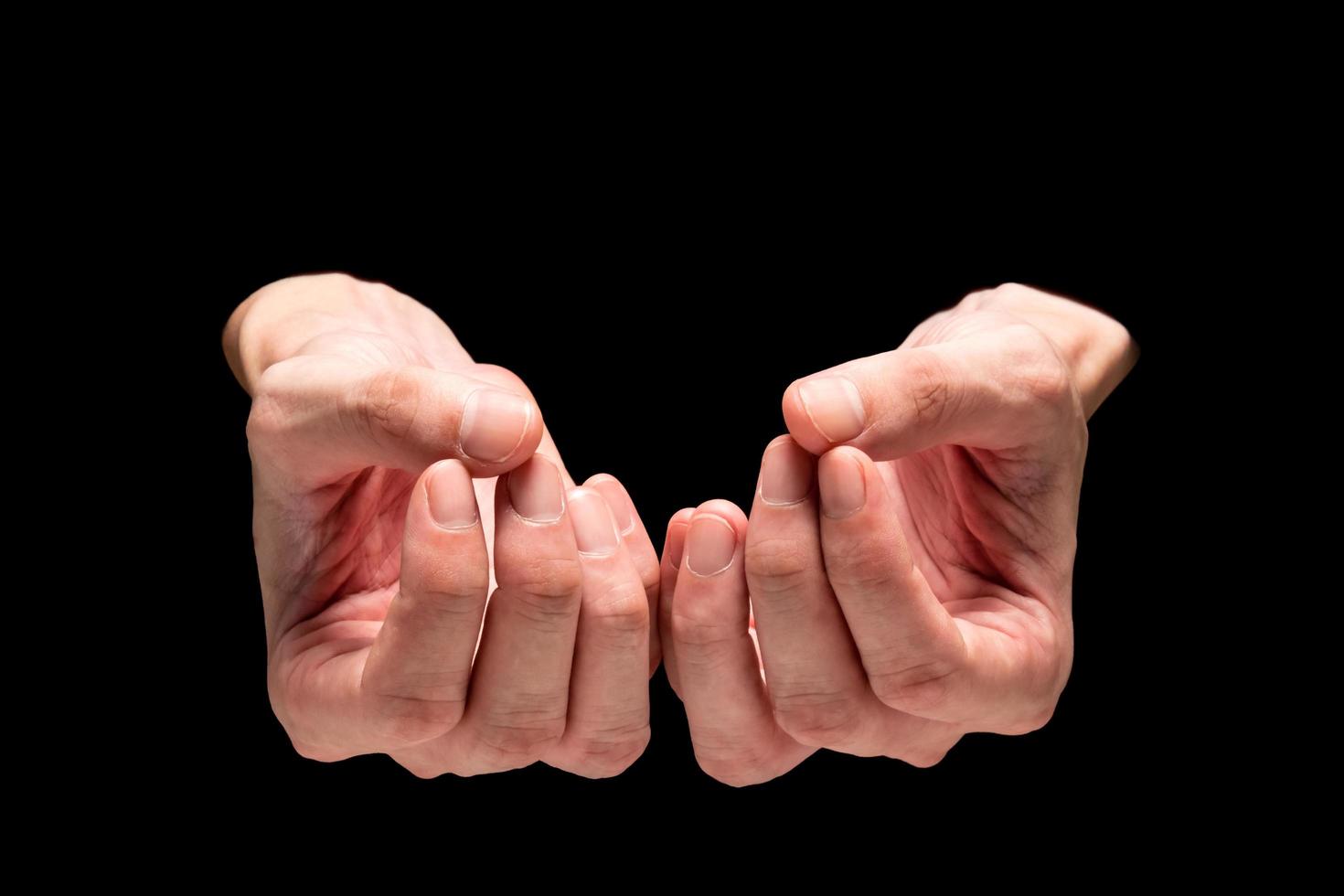 Male hands on a black background. photo