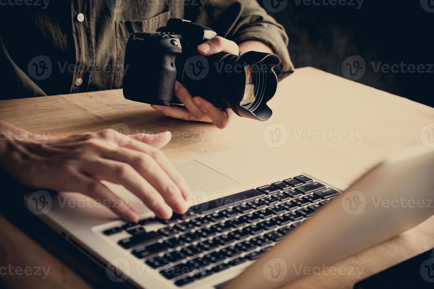 Close up of photographer editing his images on laptop. photo