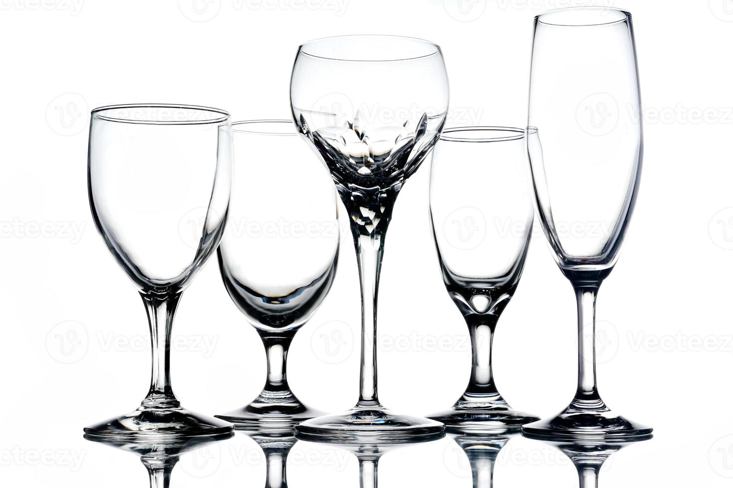 Collage of empty glasses on white background. photo