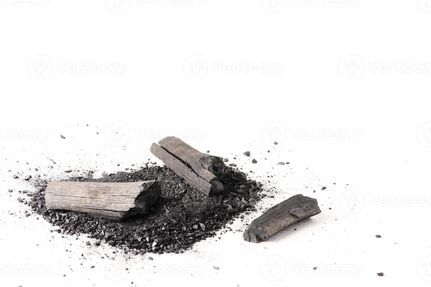 Charcoal and powder on white background. Free space for text photo