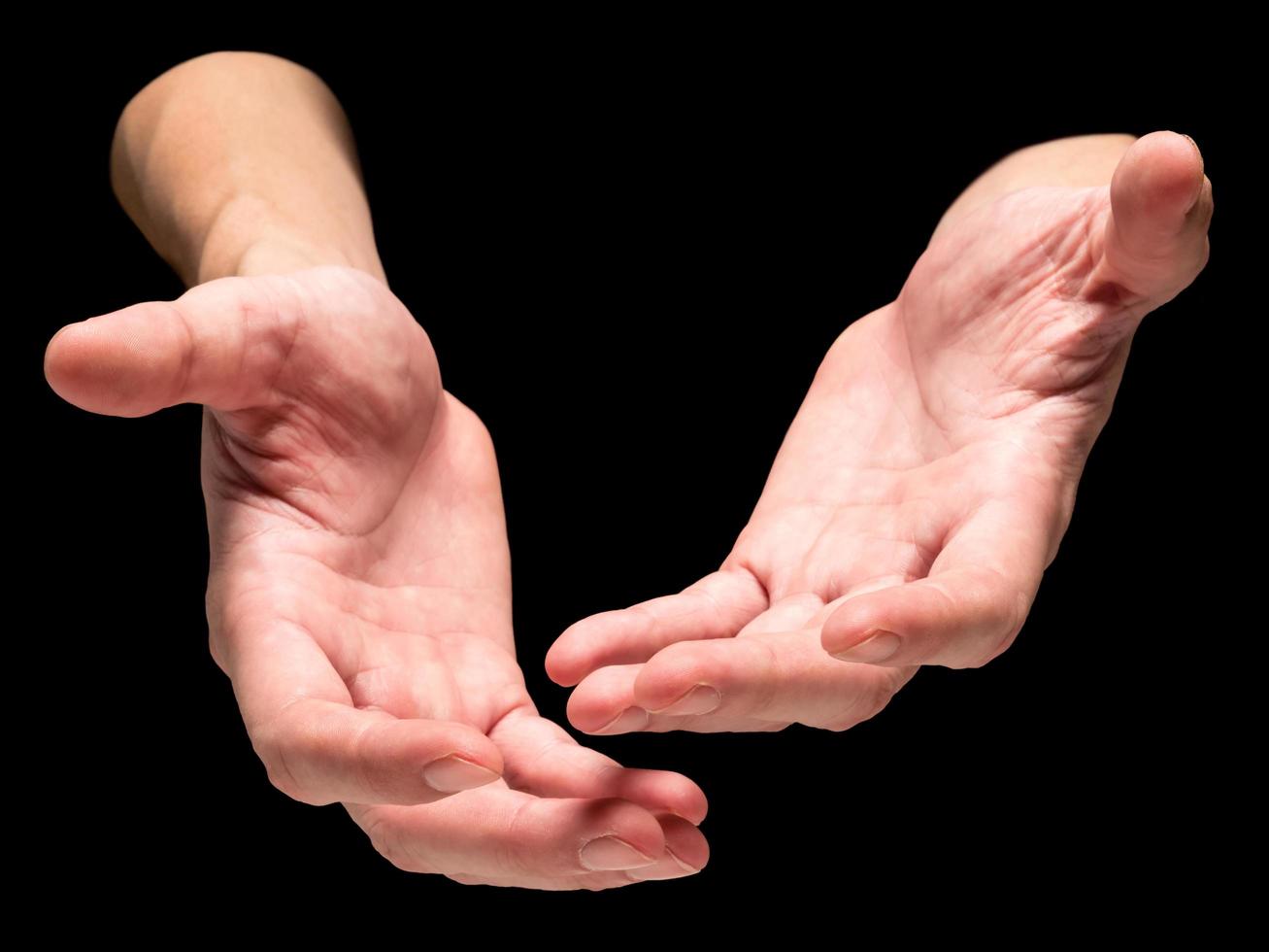 Male hands on a black background. photo