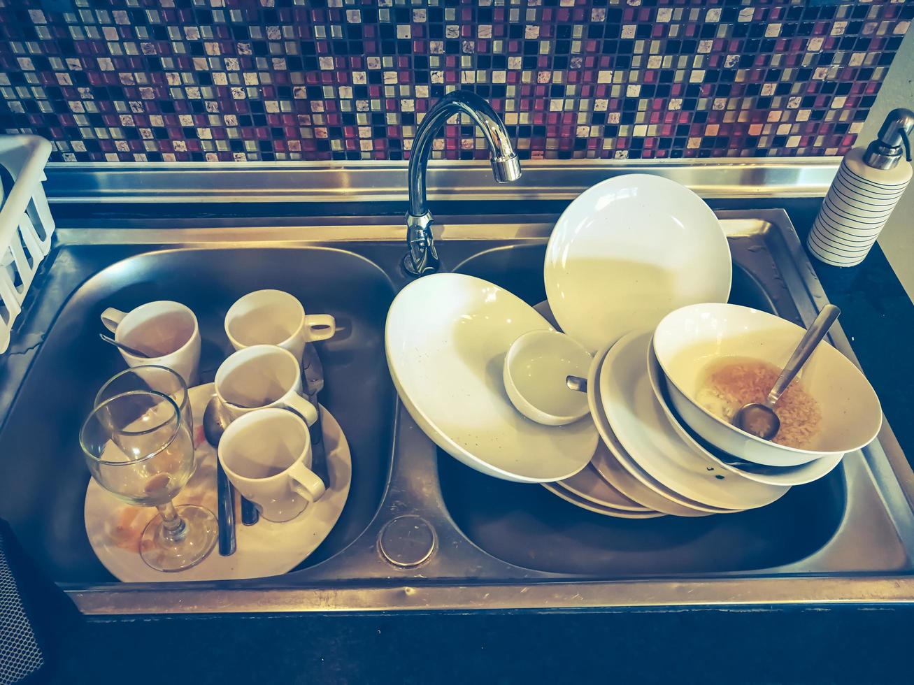 Many kitchenwares for clean in a sink. photo