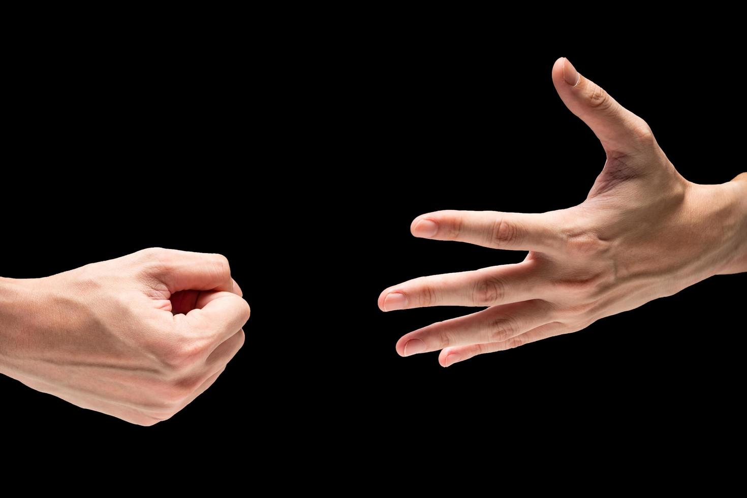 Hand symbol with rock paper scisors on a black background. photo