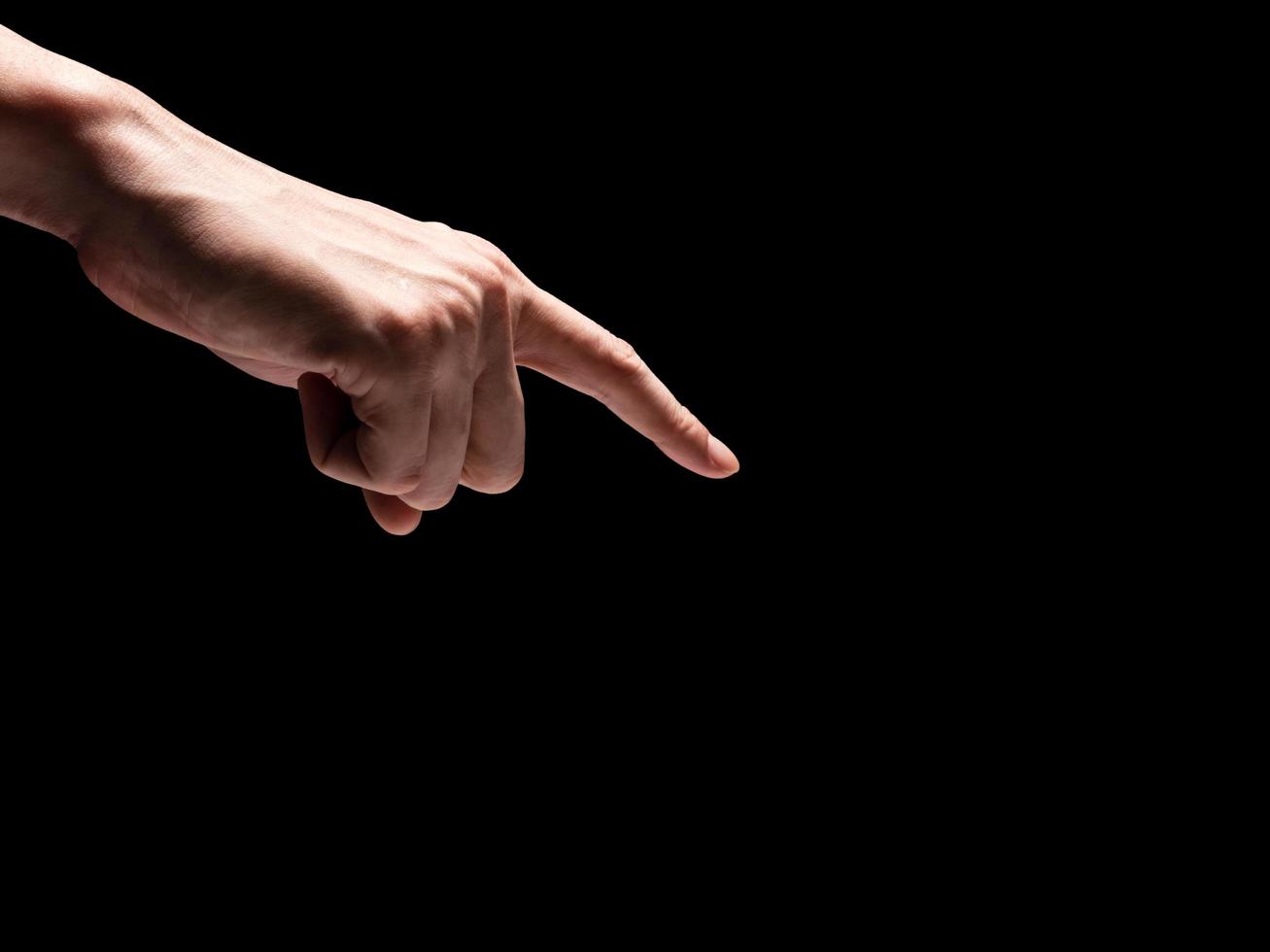 Male hands on a black background. Free space for text photo