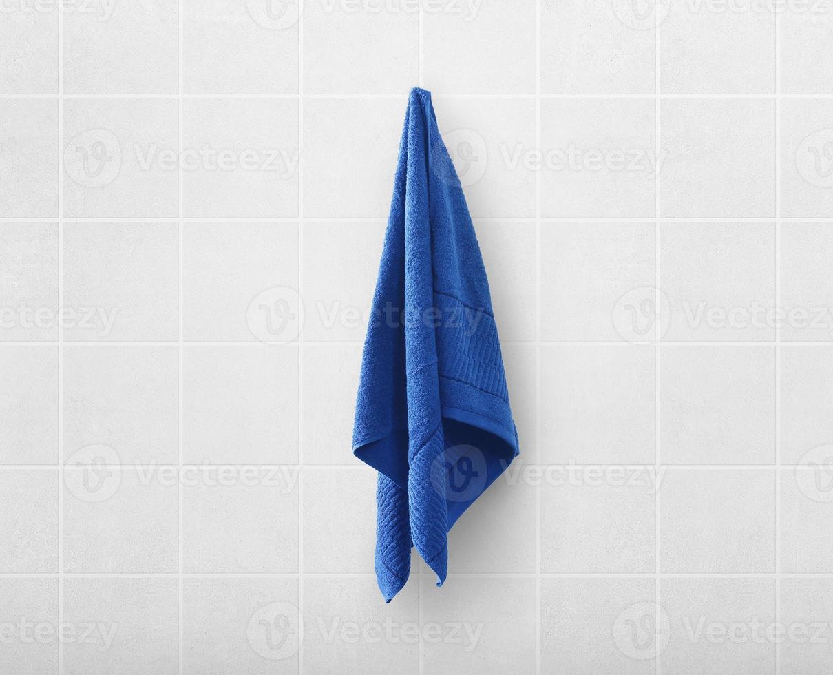 blue towels on hanger in toilet bathroom photo