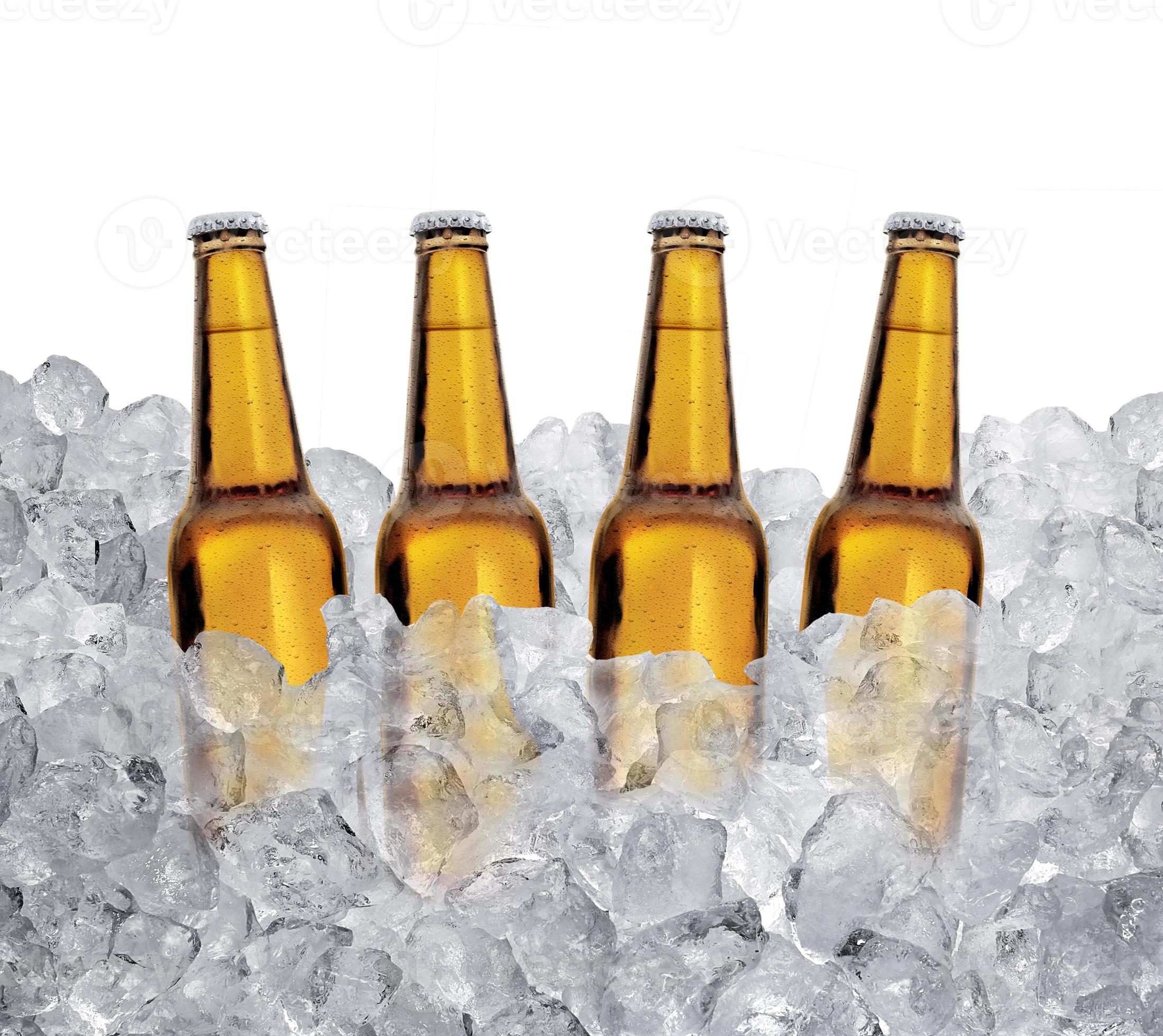 Three bottles of beer on ice cubes Isolated on white background
