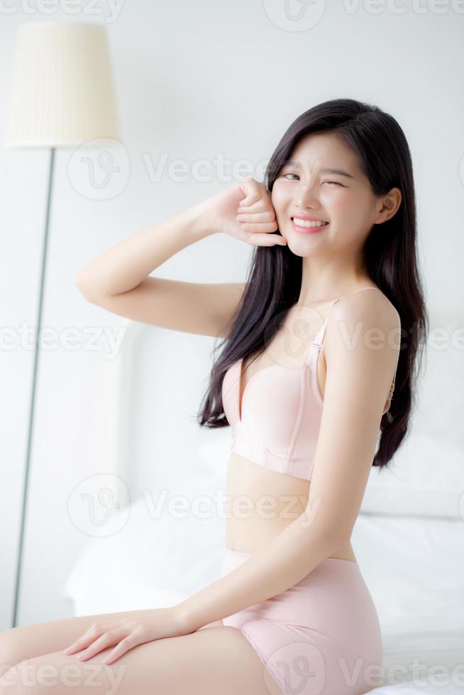 Beautiful portrait young asian woman sexy in underwear figure fit relax with seductive in bedroom, beauty asia girl body slim in lingerie confident and happy stand in bedchamber, lifestyle concept. photo