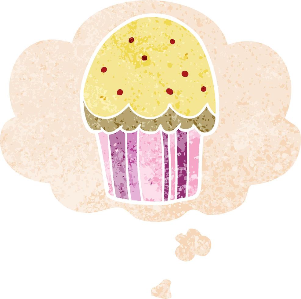 cupcake de dibujos animados y burbuja de pensamiento en estilo retro texturizado vector