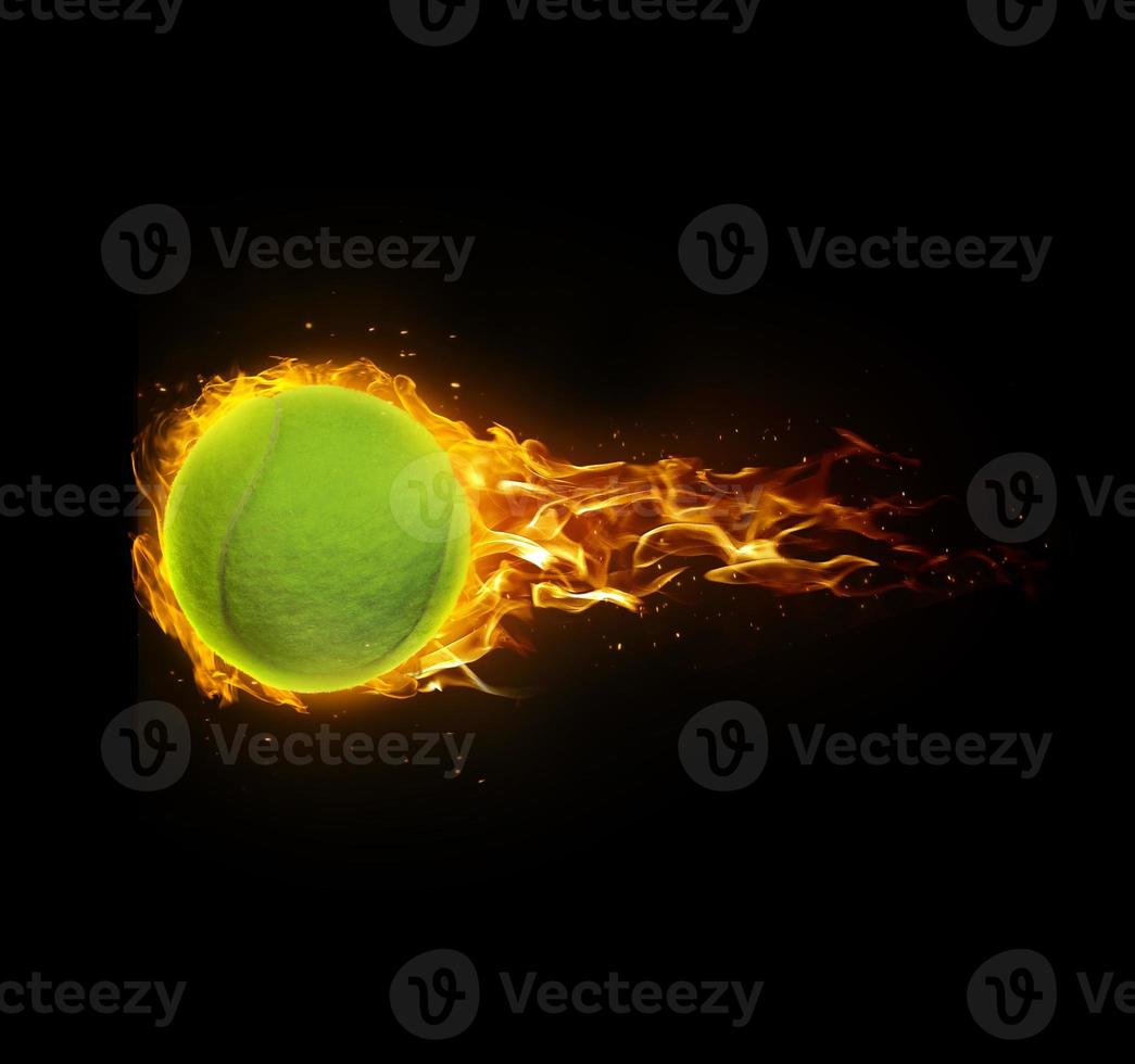 Tennis ball, on fire on black background photo