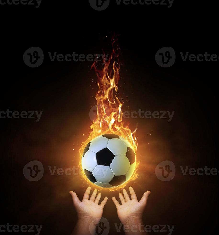 soccer ball ball. on black background with smoke, yellow orange red white colored back lights photo