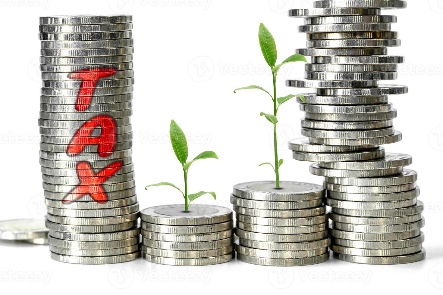 stacked coins and plant growing with tax concept on white background photo