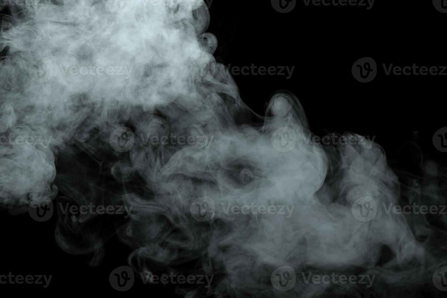 Abstract powder or smoke isolated on black background photo