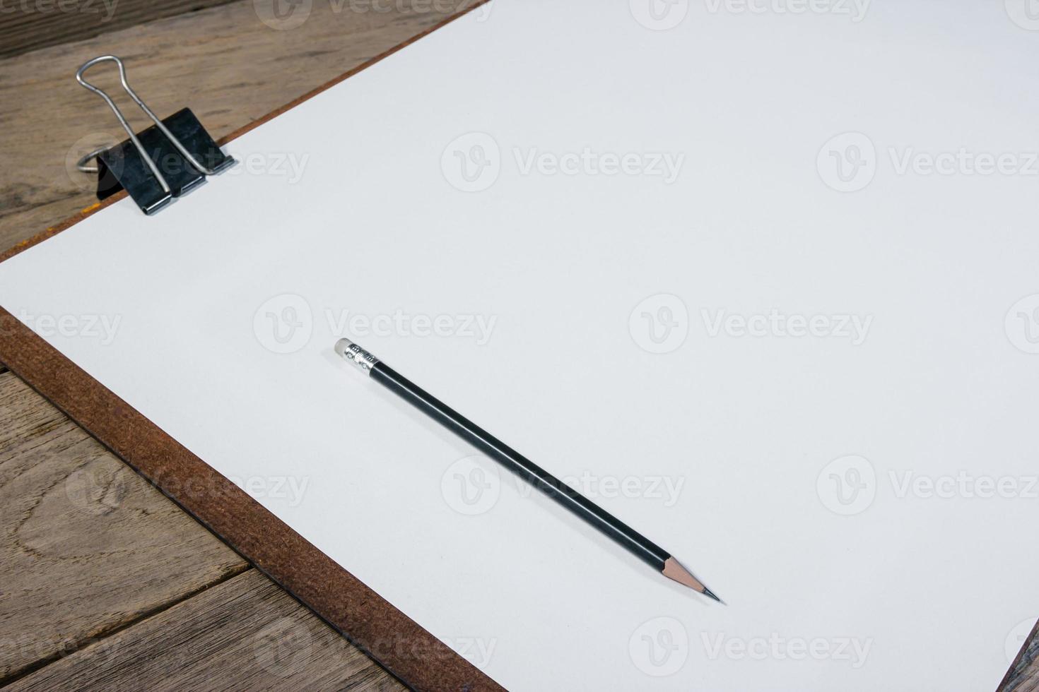 drawing board with paper on desk photo