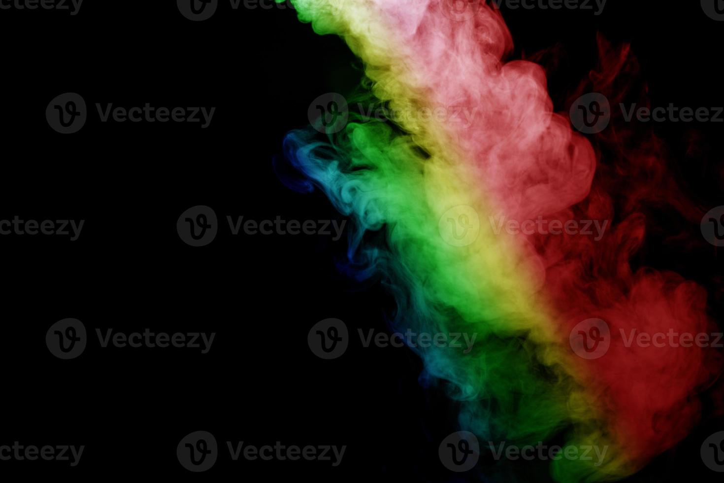 Abstract smoke isolated on black background,Rainbow powder photo