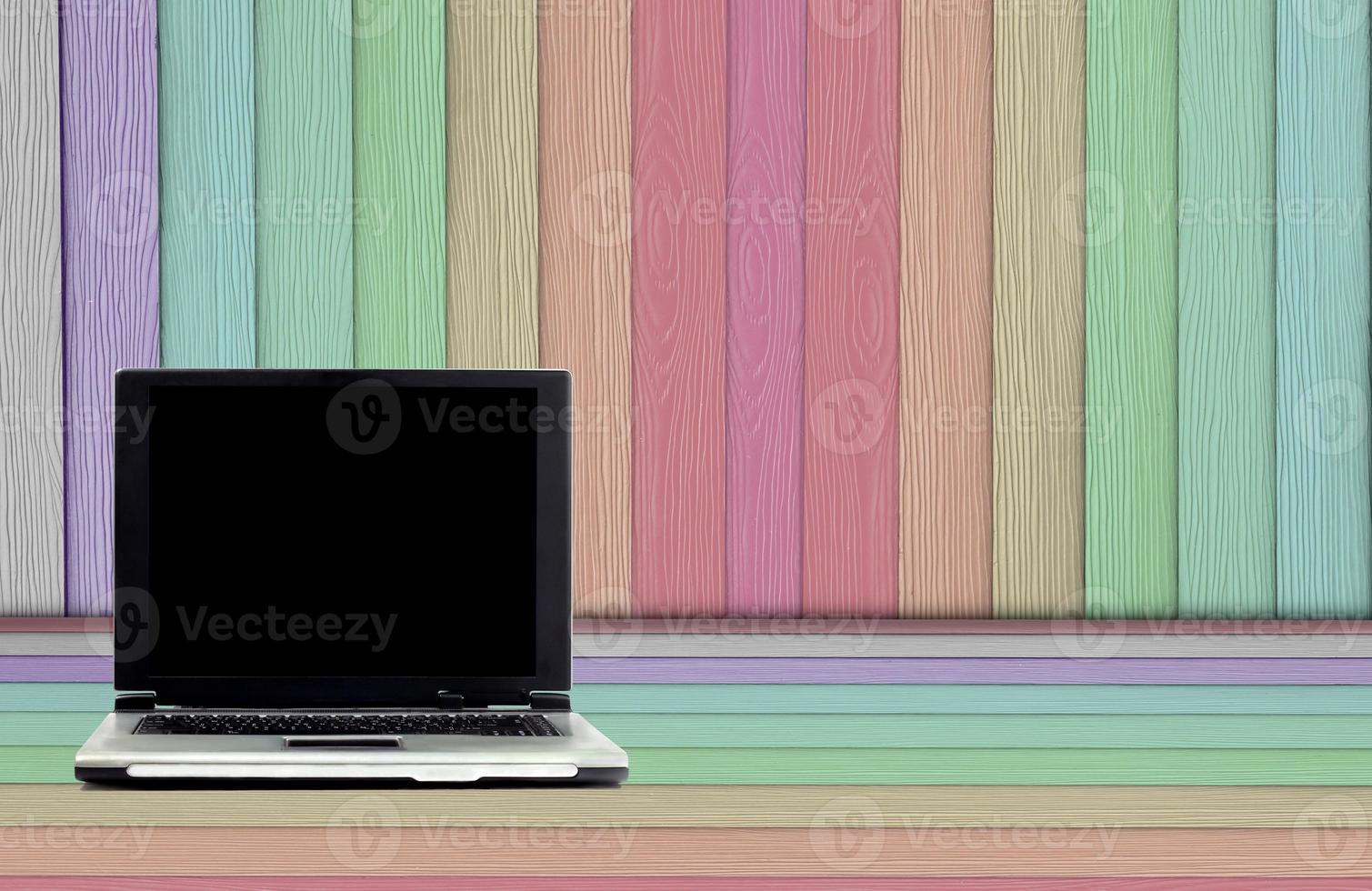 laptop on artificial wood photo