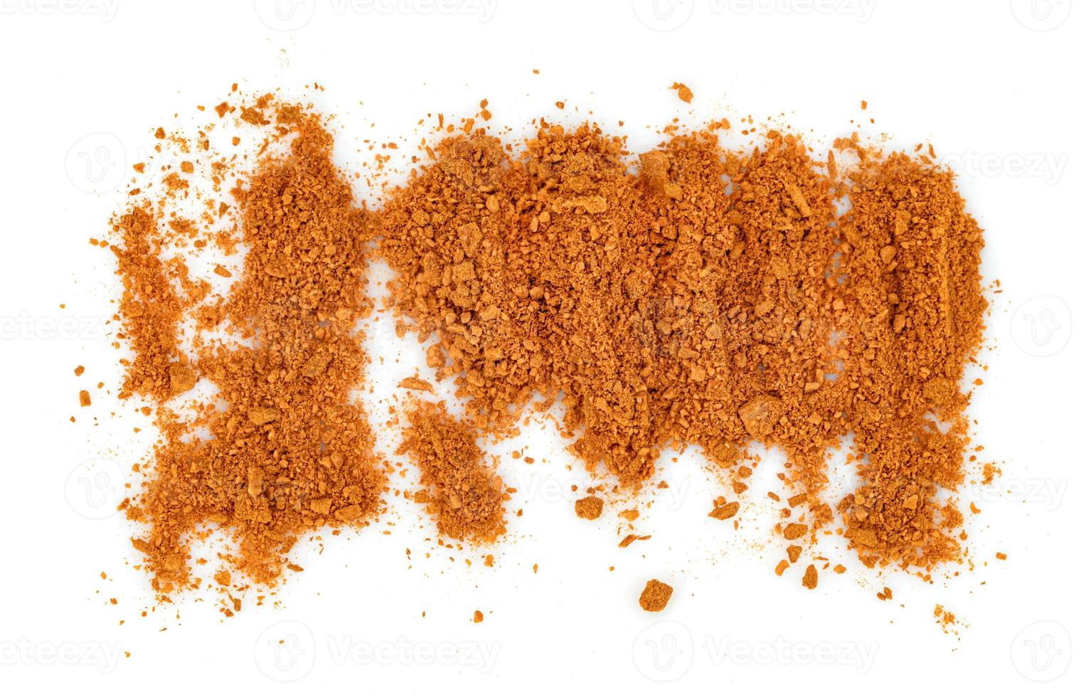 cinnamon powder  isolated on white background photo