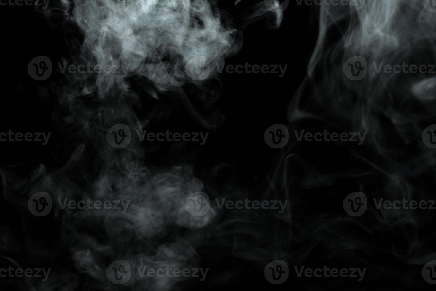 Abstract powder or smoke isolated on black background photo